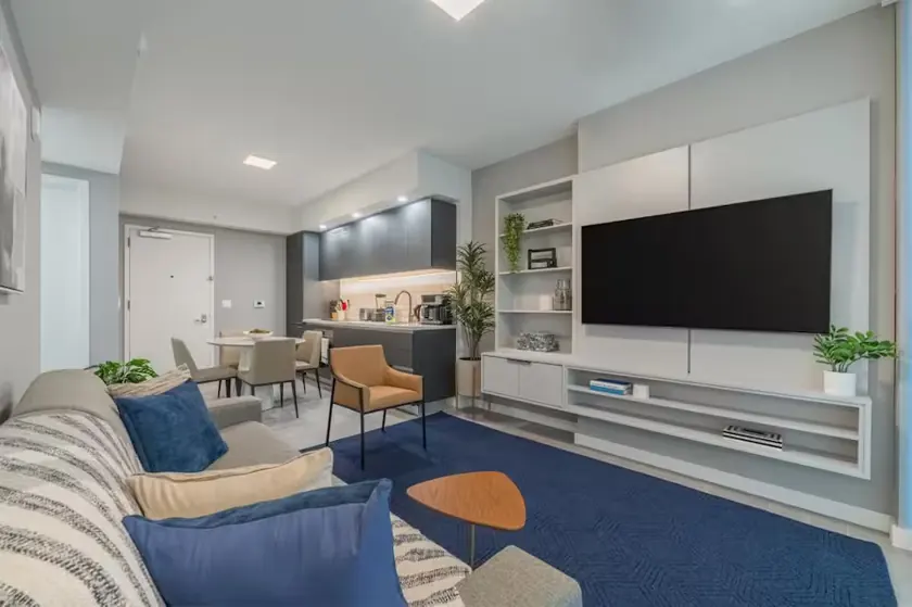 Blue-accented living and dining room in Downtown Miami apartment 1905
