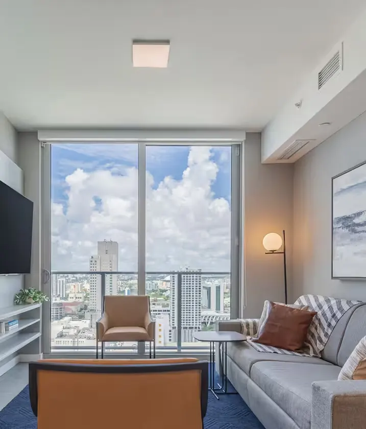 Living room facing the Miami skyline in apartment 3104